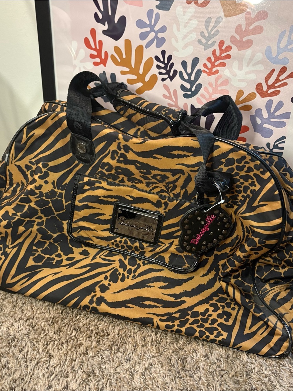 Betseyville by Betsey Johnson Animal Print Rolling Duffel Luggage